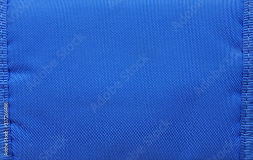 Blue texture background, light blue color material. Empty sewn textile material, blank seamless background frame of light blue color with copy space