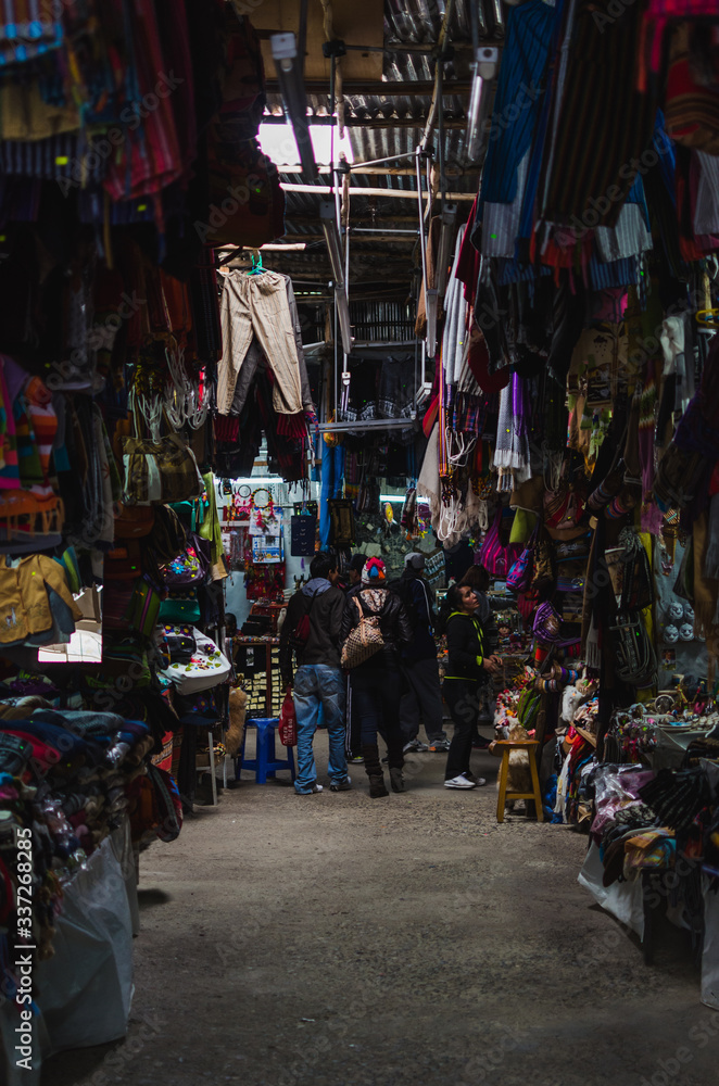 Huaraz, Peru, July 28, 2014: Peruvian tourist market with souvenirs, typical products and people watching.