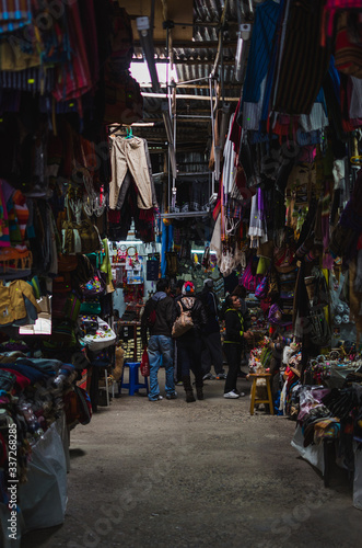 Huaraz, Peru, July 28, 2014: Peruvian tourist market with souvenirs, typical products and people watching.