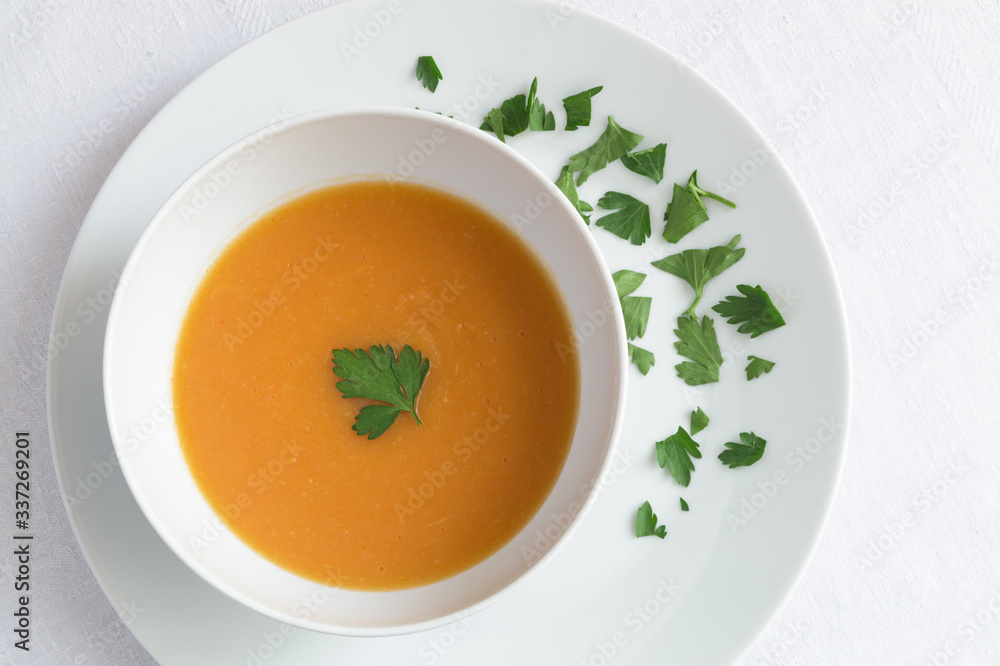 pumpkin soup puree decorated with parsley pumpkin soup puree decorated with parsley