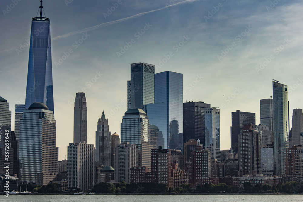 New York City with buildings, streets, during clear day New York City with buildings, streets, during clear day