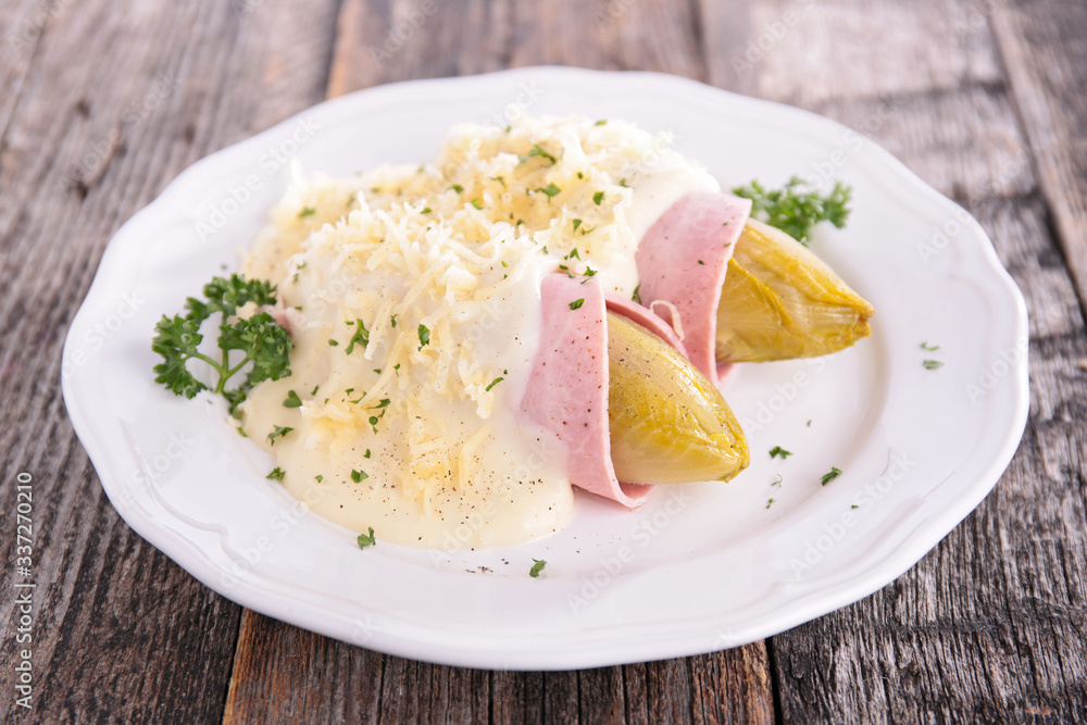 baked chicory with ham, cream and cheese