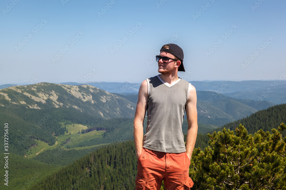 Young man traveling on a mountain top