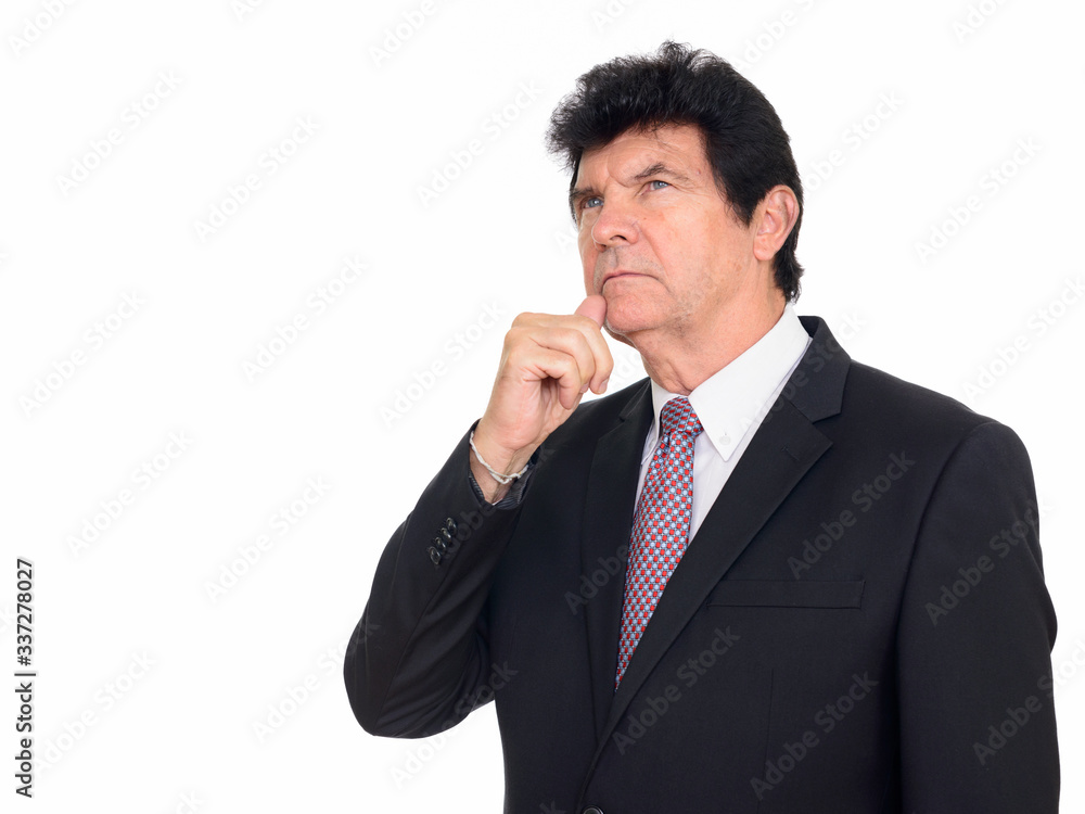 Portrait of mature handsome businessman in suit thinking Portrait of mature handsome businessman in suit thinking