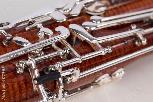 Wooden bassoon isolated on a white background. Music instruments. © juananbarros
