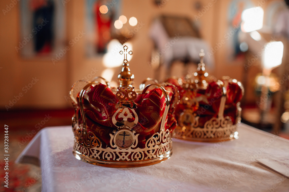 a pair of two golden crowns for weddings, weddings in the church temple at the divine liturgy ceremony