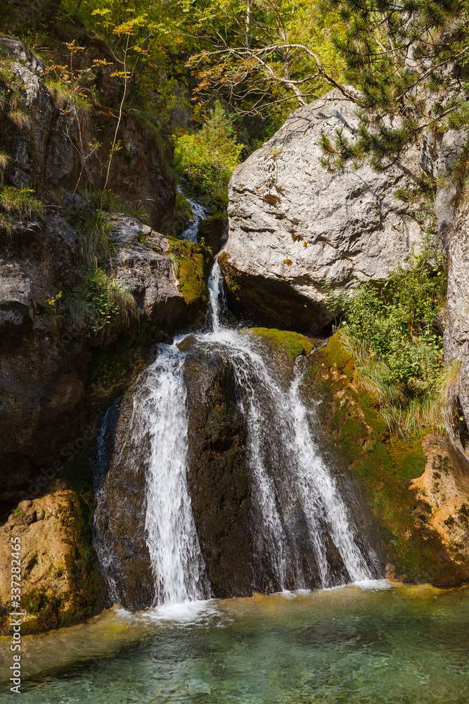 Enipeas waterfall with small lake surrounded by trees Enipeas waterfall with small lake surrounded by trees