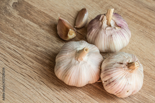 old garlic close-up on a wooden background