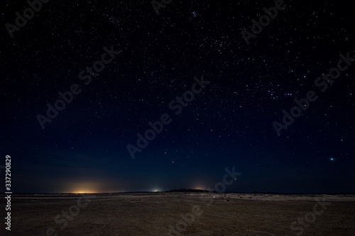 Gorgeous night image with brilliant stars in the middle of the desert in Masirah island, Oman © RG41_official