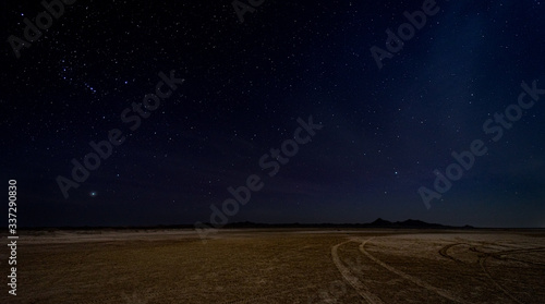 Gorgeous night image with brilliant stars in the middle of the desert in Masirah island, Oman