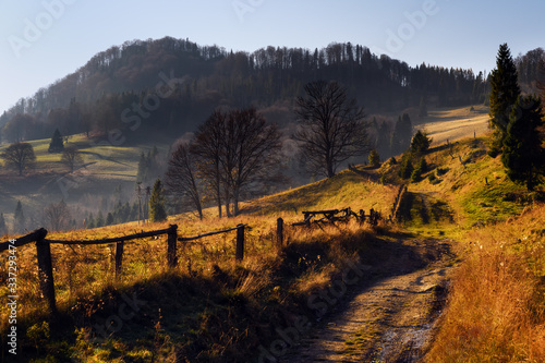 Beautiful, colorful autumn sunrise in The Pieniny Mountains (Male Pieniny) - view from the exit from the Homole Gorge towards the Wysoka peak, Jaworki, Poland.