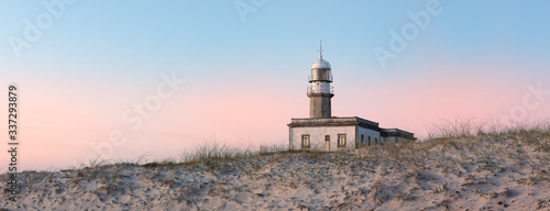 Lighthouse behind the dune