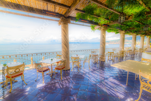 Tables and chairs in a beautiful terrace by the sea in Sorrento © Gabriele Maltinti