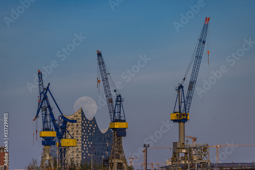 Hamburg/Hamburg/Germany-04072020: Full moon in the harbour over the Elbphilharmonie