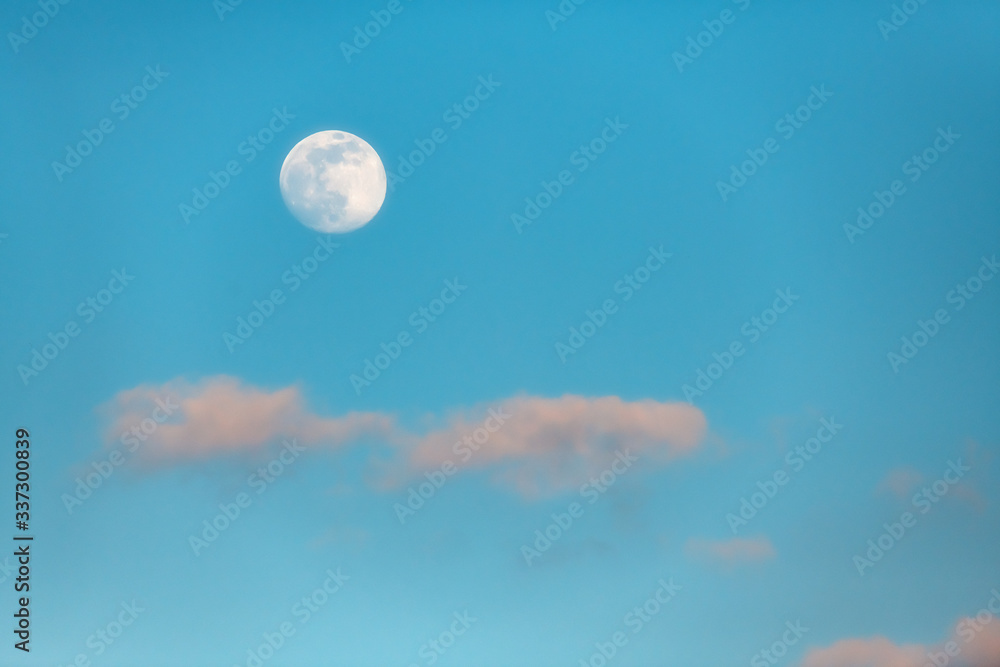 Full moon and some clouds at dawn.