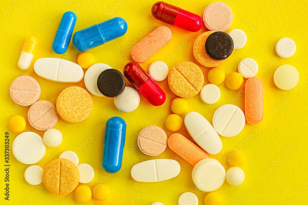 pills, different pills and drugs to treat and increase immunity, medical preparations. background top view. copy space for text pills, different pills and drugs to treat and increase immunity, medical preparations. background top view. copy space for text