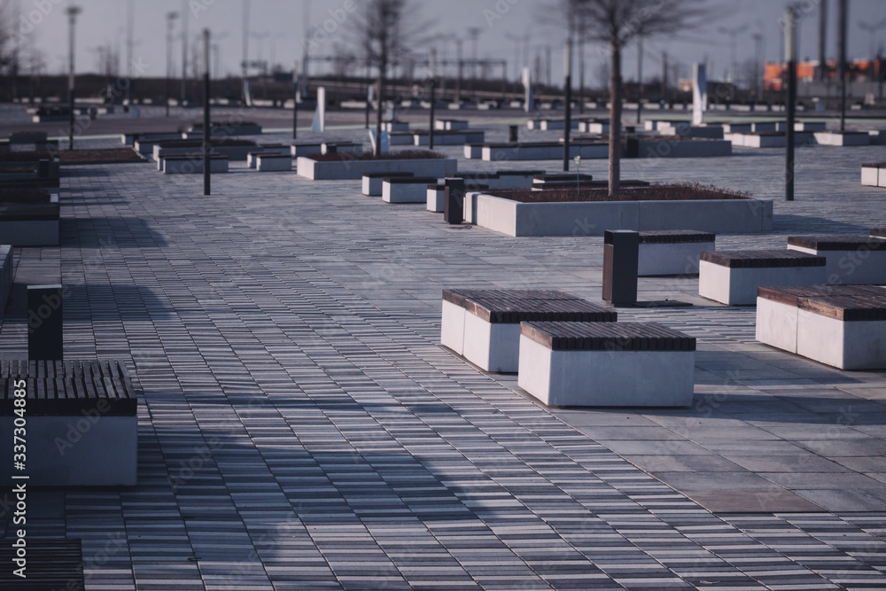 Fototapeta premium empty benches of a city park due to quarantine