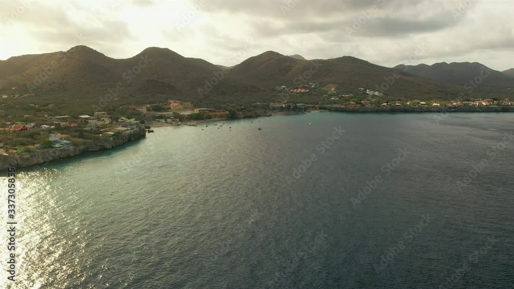 Aerial view of coast of Curacao in the Caribbean Sea with turquoise water, cliff, beach and beautiful coral reef Aerial view of coast of Curacao in the Caribbean Sea with turquoise water, cliff, beach and beautiful coral reef