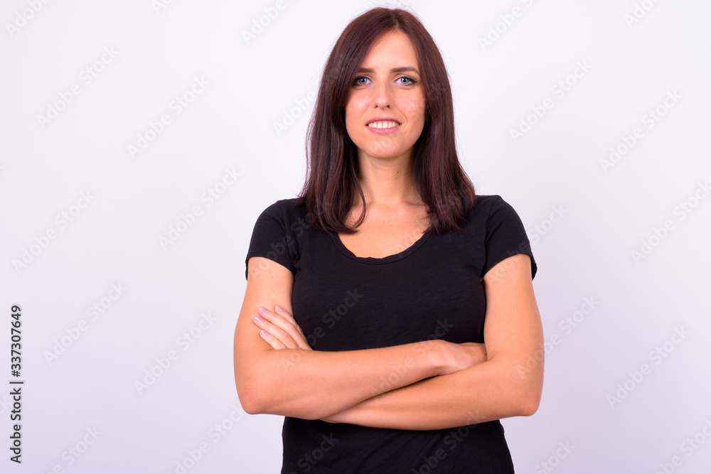 Portrait of happy young beautiful woman smiling with arms crossed Portrait of happy young beautiful woman smiling with arms crossed