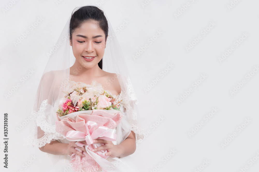 Asian woman is wearing wedding dress with free space on white background Asian woman is wearing wedding dress with free space on white background