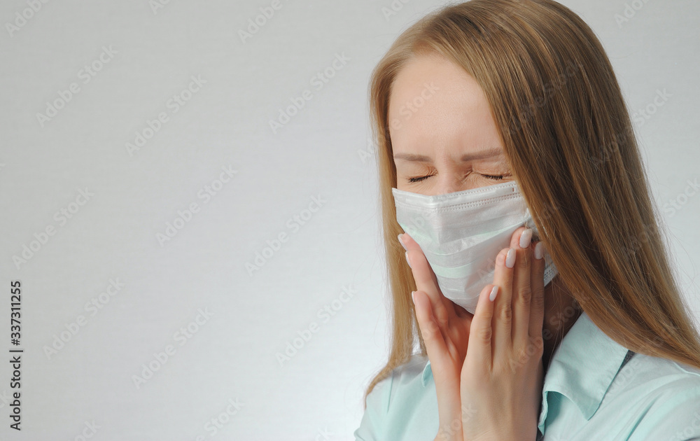 young blonde girl with toothache with medical mask young blonde girl with toothache with medical mask