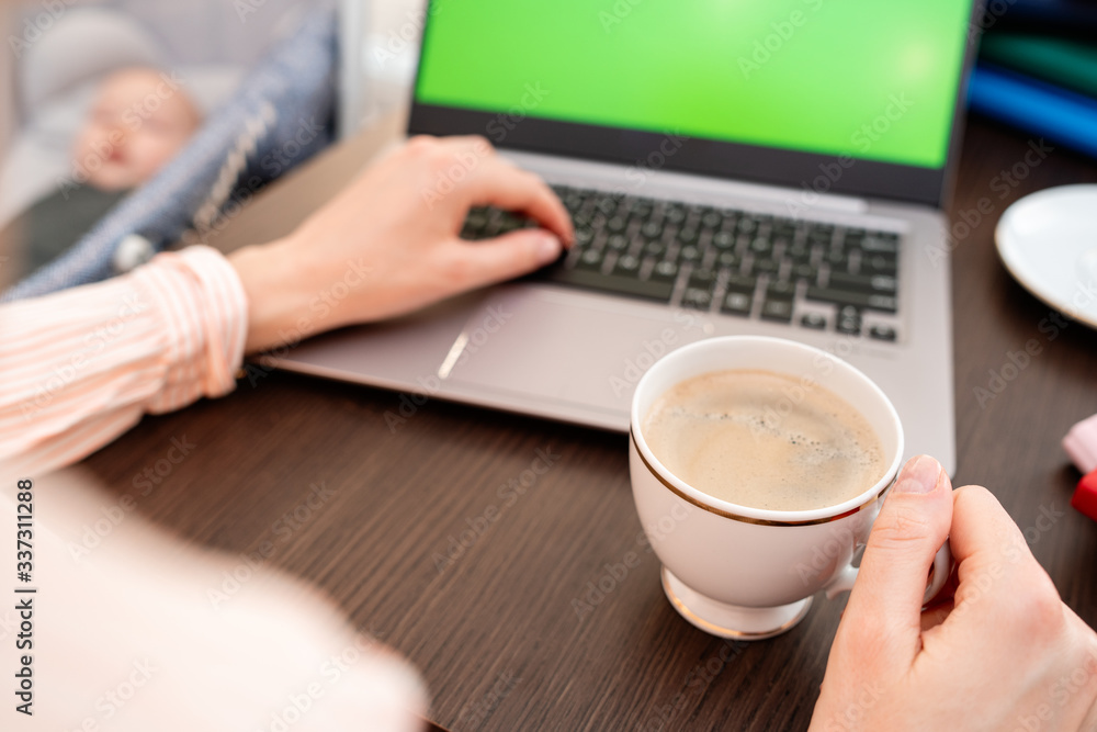 Woman hands typing laptop computer with blank screen for mock up template background, business technology and lifestyle background concept. She is drinking coffee. Woman hands typing laptop computer with blank screen for mock up template background, business technology and lifestyle background concept. She is drinking coffee.