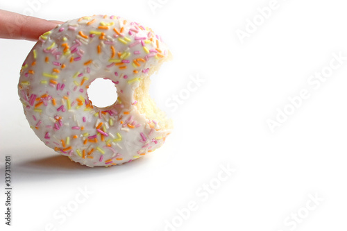 Donut with Pink and Yellow with icing and topping isolated on a White Background