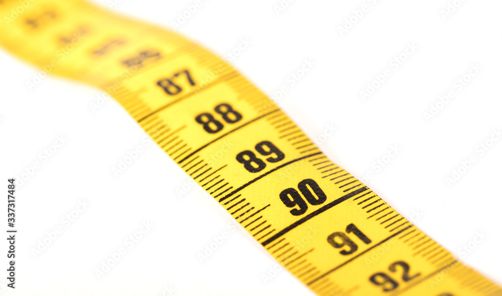 Close-up of a yellow measuring tape isolated on white - 90 Close-up of a yellow measuring tape isolated on white - 90