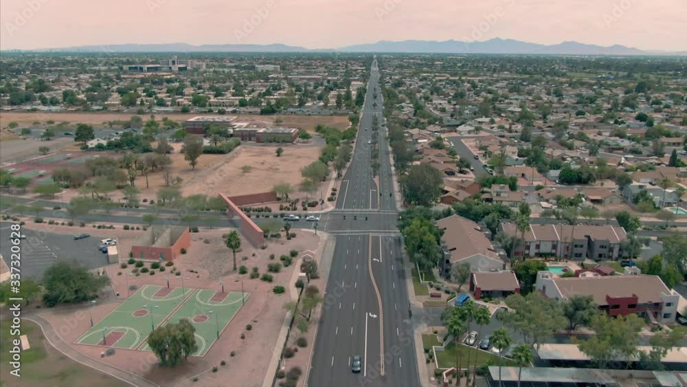 Aerial: flying over traffic and houses in Glendale. Phoenix, Arizona, USA. Aerial: flying over traffic and houses in Glendale. Phoenix, Arizona, USA.