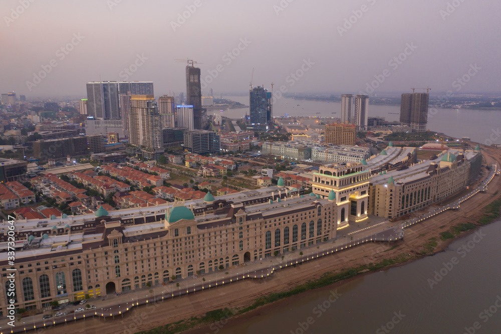 Fototapeta premium Phnompenh capital of Cambodia on the sunset with beautiful landscape by drone