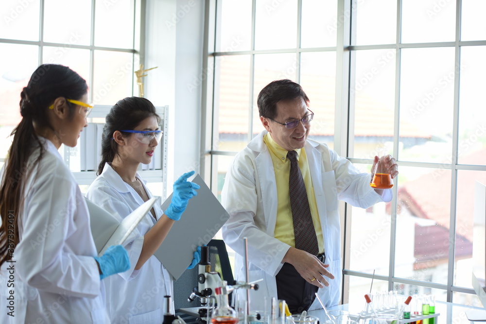 Scientists working in laboratory Scientists working in laboratory