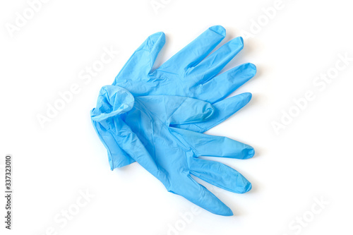 A pair of thin blue medical latex gloves Disposable rubber medical gloves. Protective subjects. Remedies.