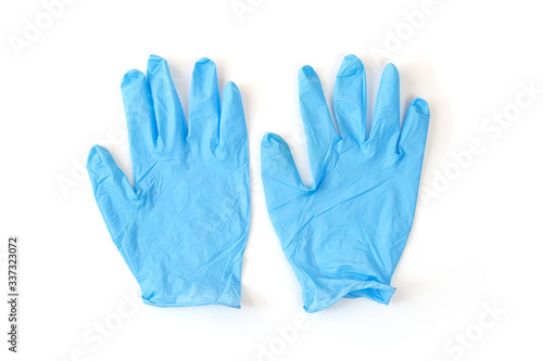 A pair of thin blue medical latex gloves Disposable rubber medical gloves. Protective subjects. Remedies.