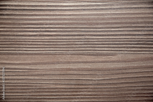 Brown grainy wood background texture, close-up