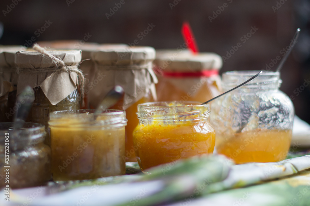 Delicious berry and fruit jams and sauces in glass jars. Delicious berry and fruit jams and sauces in glass jars.