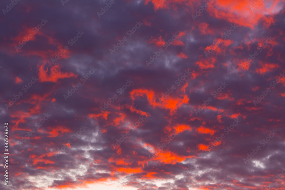 Beautiful red sunset sky. The sky, bright blue, orange colors of sunrise. Colorful dramatic sky Beautiful red sunset sky. The sky, bright blue, orange colors of sunrise. Colorful dramatic sky