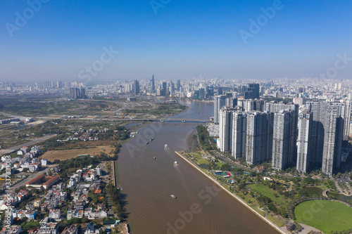 Top view aerial photo from flying drone of a Ho Chi Minh City with development buildings, transportation, energy power infrastructure