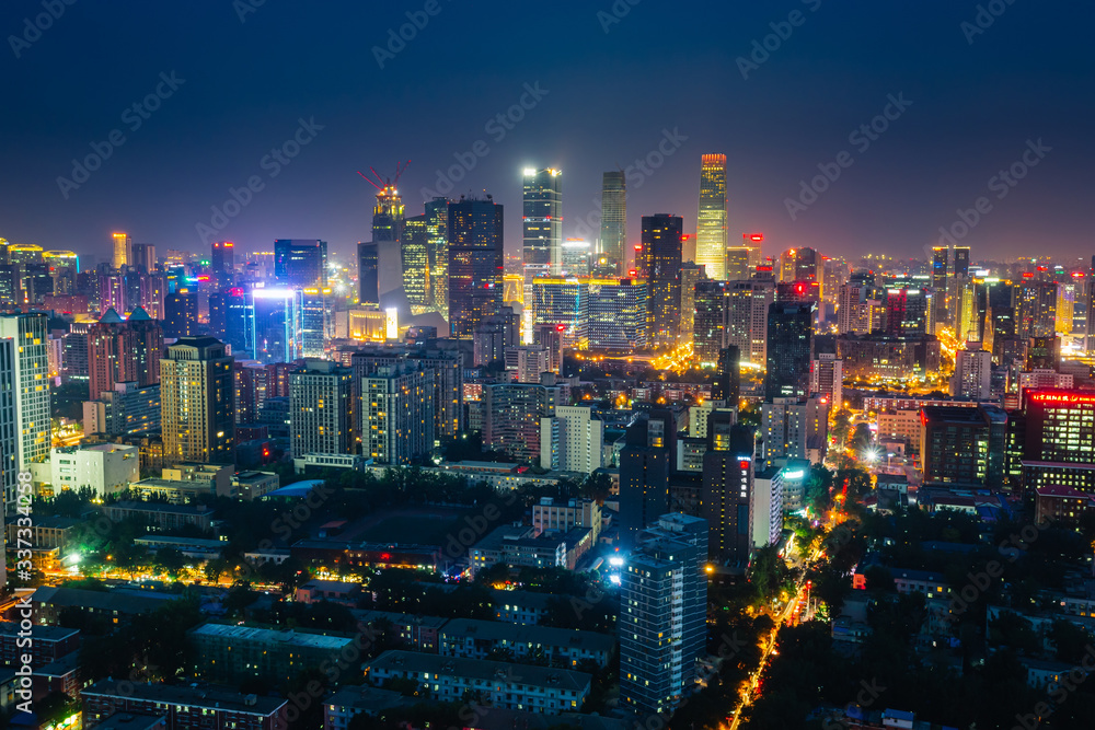 Obraz premium Futuristic city at night. Many high-rises and neon signs.