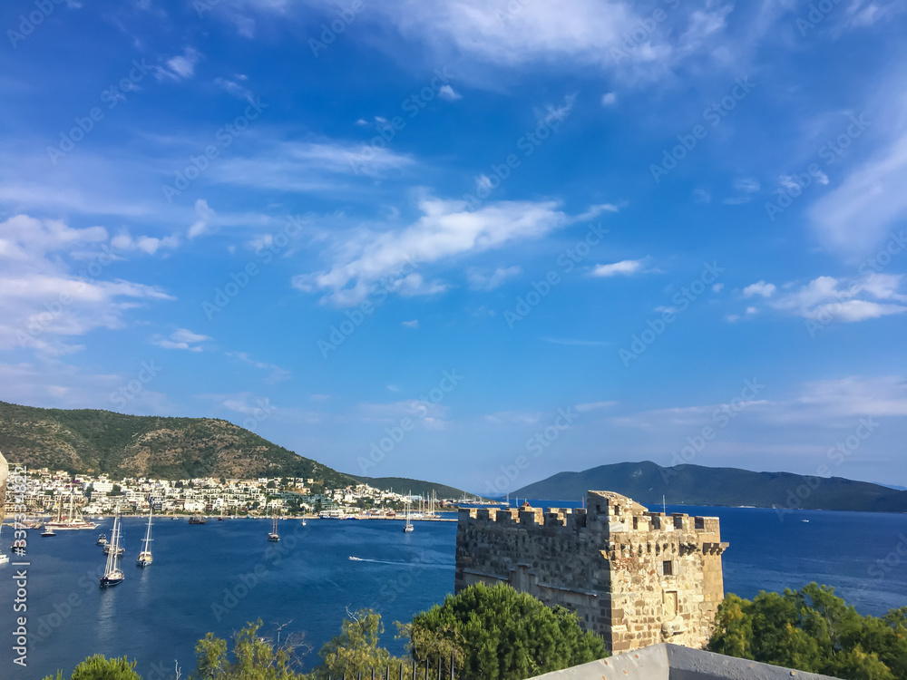 Bodrum Castle and coast view in summer with cloudy sky.