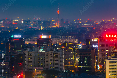 A modern city at night.