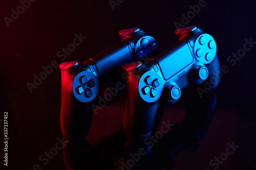  Sony Playstation 4 (PS4) DualShock 4 controller, videogame joystick or gamepad on a table. Close up studio shot. Game concept photo