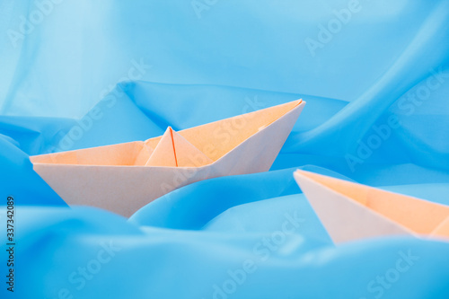 paper boats on a blue background