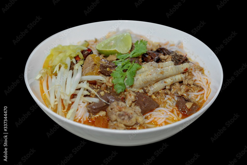 Nam ngiao Rice Noodle, Noodles with Spicy Pork Sauce on black background Nam ngiao Rice Noodle, Noodles with Spicy Pork Sauce on black background