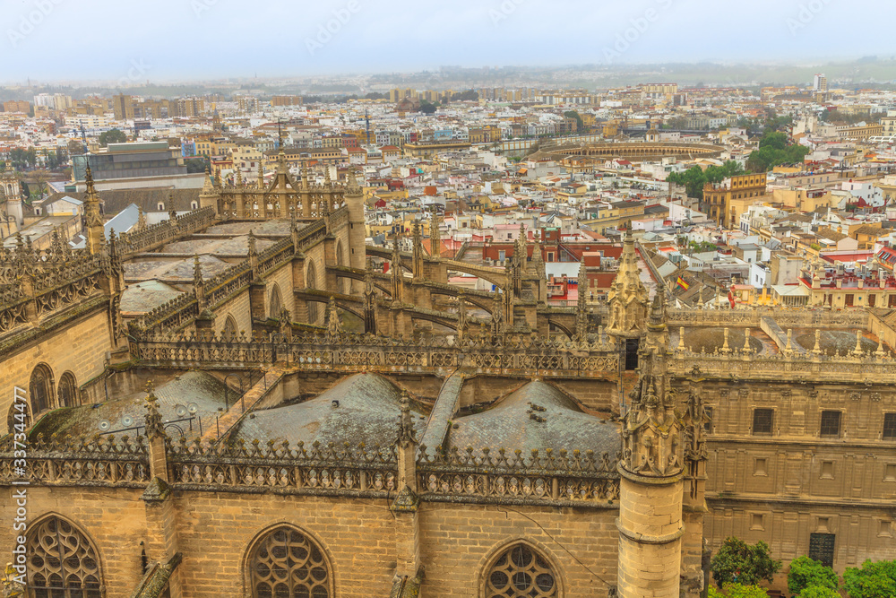 Aerial view of Seville city and Seville Cathedral of Saint Mary of the See from Giralda tower at the top of Catedral de Sevilla in Andalusia, Spain.
