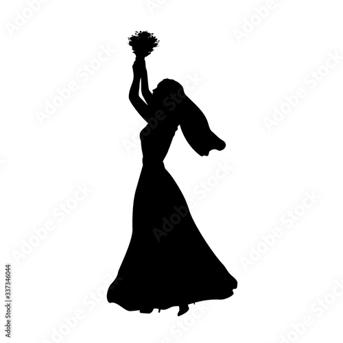 Silhouette bride throws bouquet of flowers