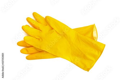 a pair of yellow latex protective gloves isolated on white background
