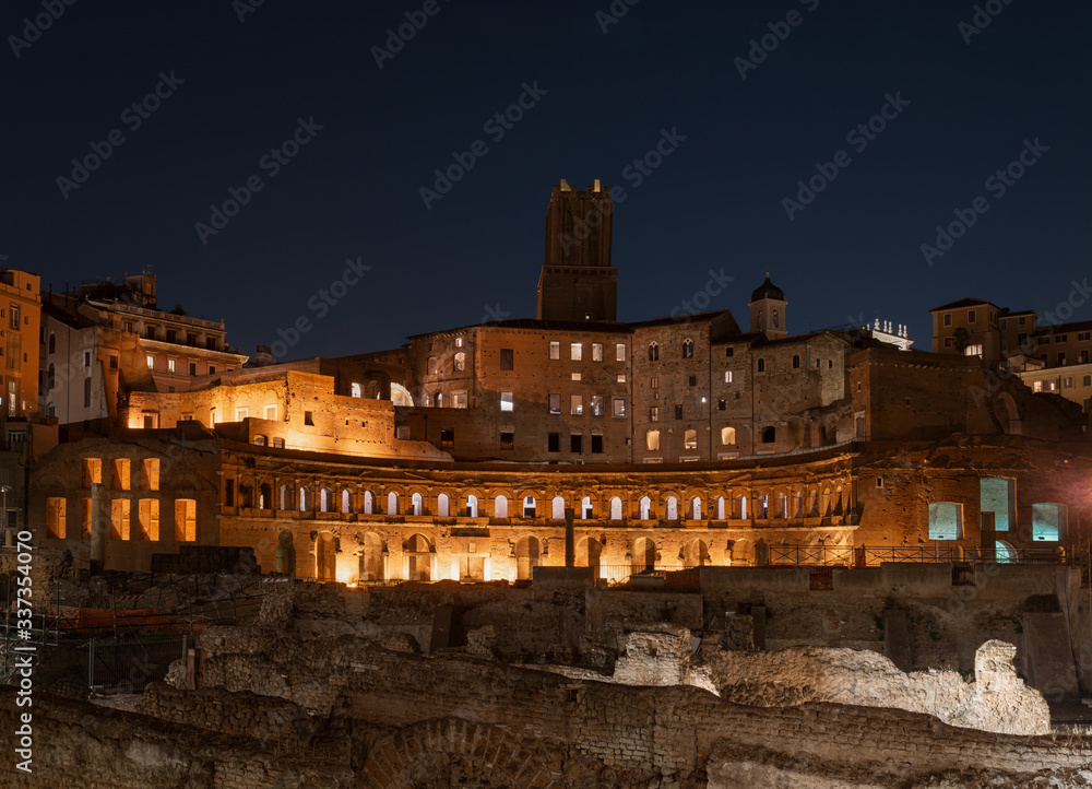 Trajan's Market, Via dei Fori Imperiali, Rome, at the opposite end of the Colosseum. The ruins overlook a splendid night view of the Forum of Trajan and the Vittoriano.
