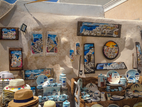 Santorini, Greece - September 10: Souvenir shop under the open sky, many beautiful paintings, pottery, Santorini, Greece.