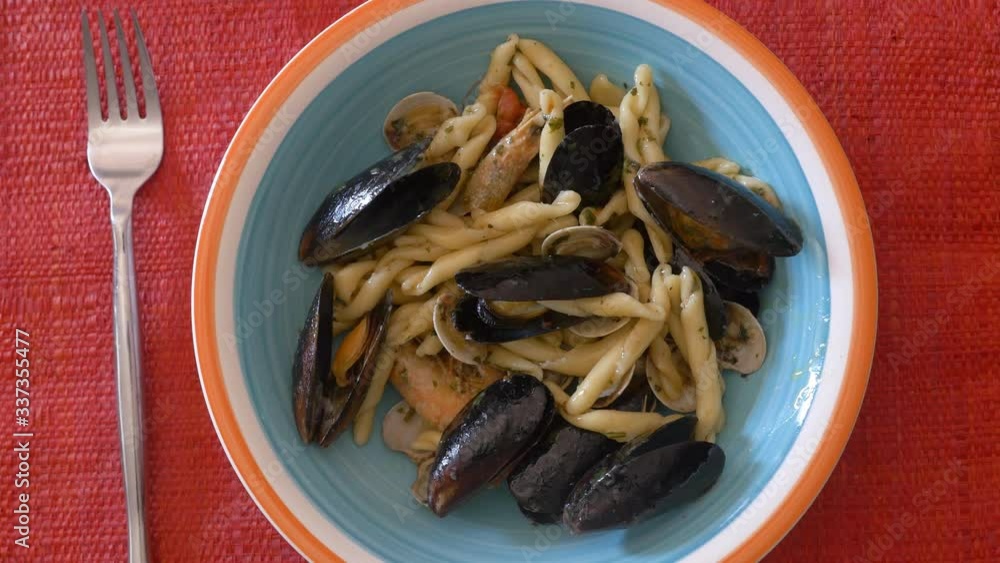 mussels, claimd, shrimps frying them in a pan with biled oil to season the pasta mussels, claimd, shrimps frying them in a pan with biled oil to season the pasta
