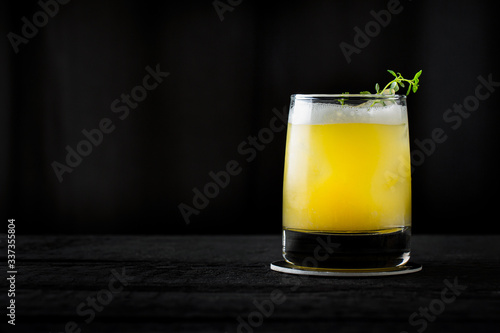 vintage style orange cocktail on black background